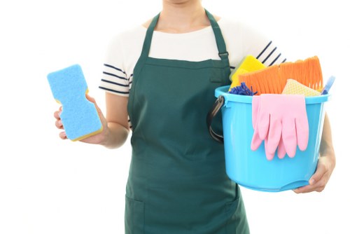 Technician preparing carpet cleaning equipment in a home interior