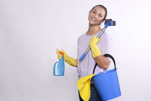 Inspector examining cleaned carpet in a living room