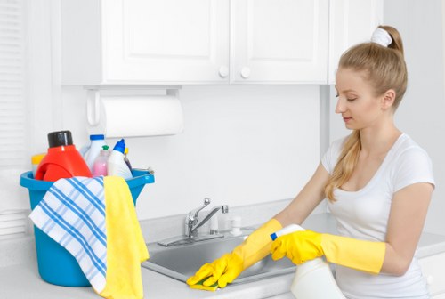 Technician using specialized tools for gutter cleaning